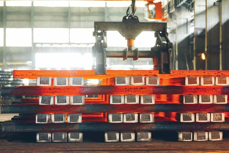 Hot steel billets moving through production